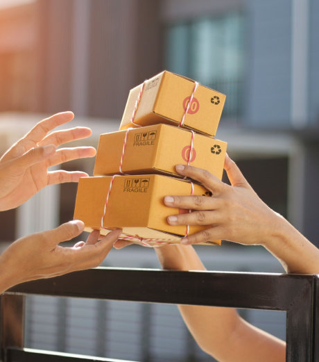 Two people holding a box